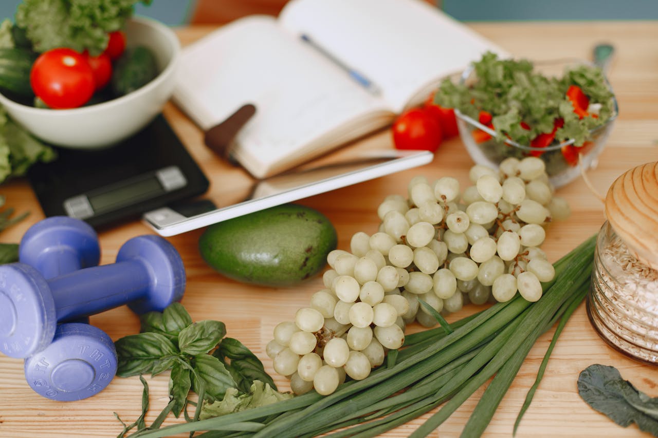 A vibrant composition of fruits, vegetables, and fitness items promoting a healthy lifestyle.